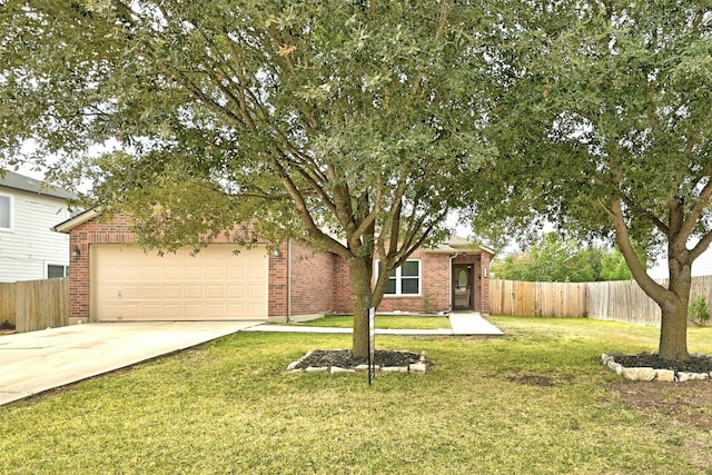 view of front of house with a garage and a front yard