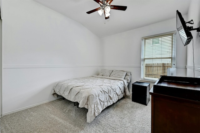 carpeted bedroom featuring ceiling fan and lofted ceiling