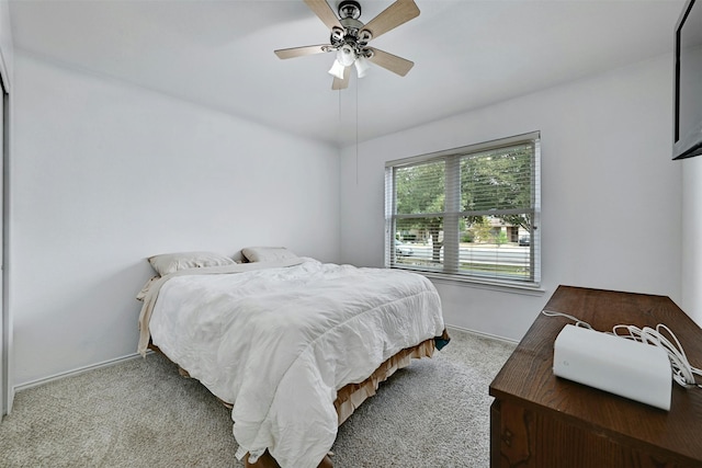 bedroom featuring ceiling fan and carpet flooring