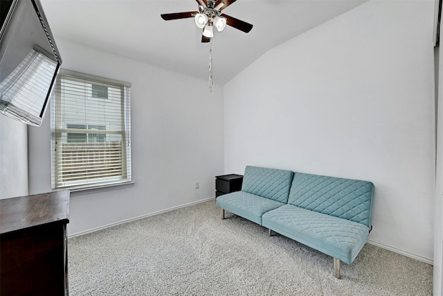 living area featuring vaulted ceiling, plenty of natural light, carpet floors, and ceiling fan