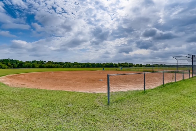 view of community with a yard and a rural view