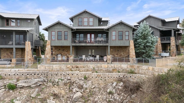 rear view of house featuring a balcony