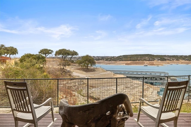 balcony featuring a water view