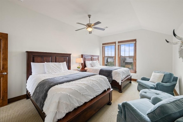 carpeted bedroom with ceiling fan and lofted ceiling