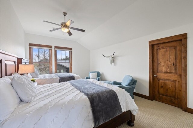 carpeted bedroom featuring ceiling fan and lofted ceiling