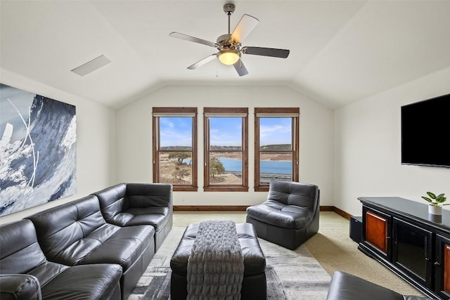 carpeted living room with lofted ceiling and ceiling fan