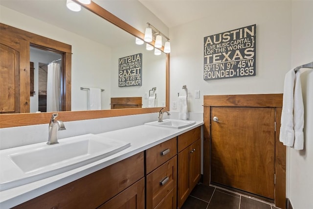 bathroom with tile patterned flooring and vanity