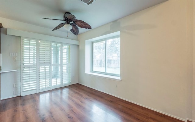 spare room with ceiling fan and hardwood / wood-style floors