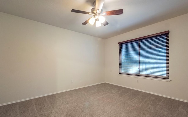 empty room with carpet and ceiling fan