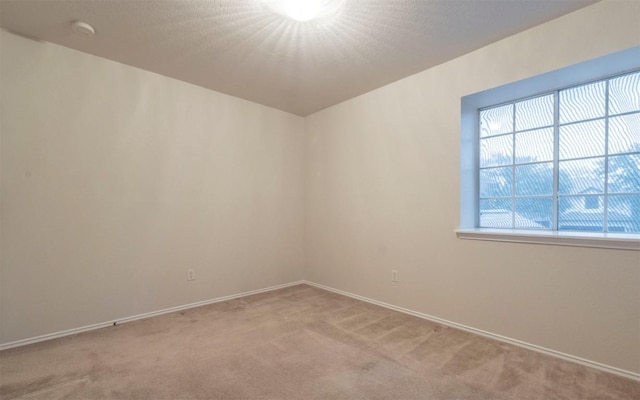 empty room with light colored carpet