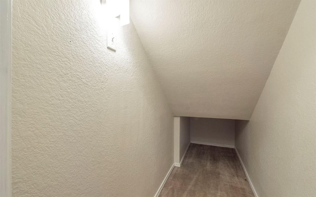 interior space with wood-type flooring and a textured ceiling