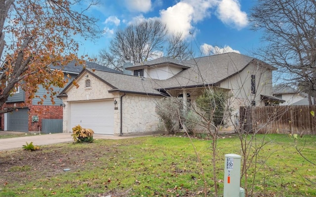 view of front of property with a garage and a front yard