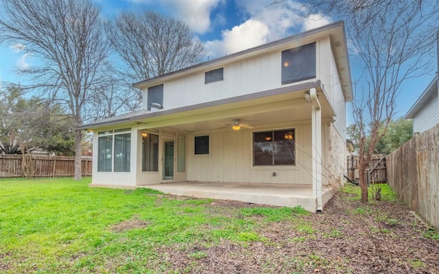 back of house with a lawn, ceiling fan, and a patio area