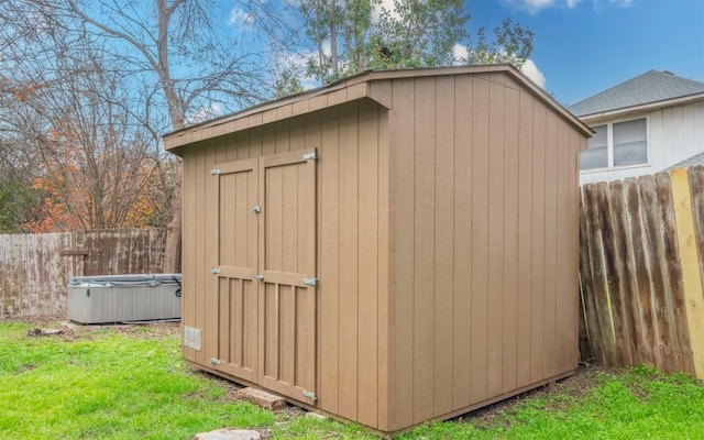 view of outdoor structure with a lawn