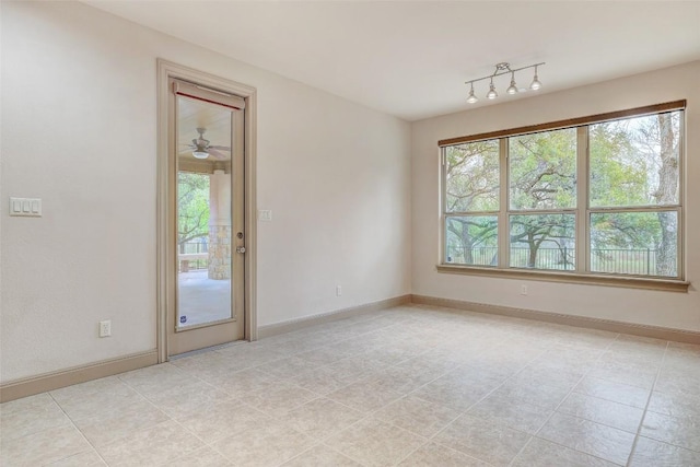 empty room with light tile patterned floors