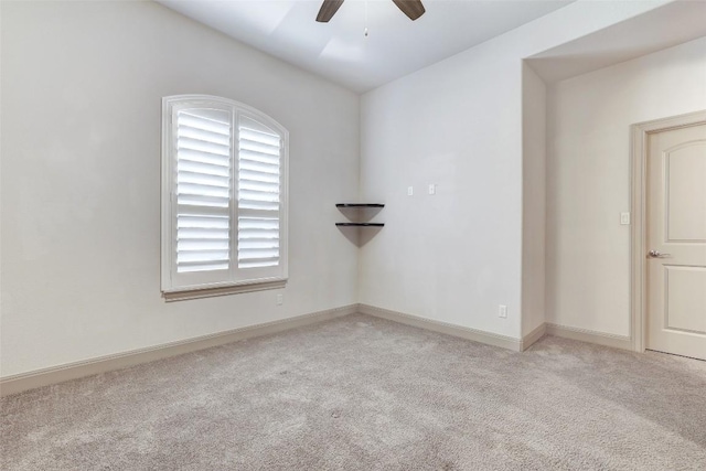 unfurnished room featuring ceiling fan and light colored carpet