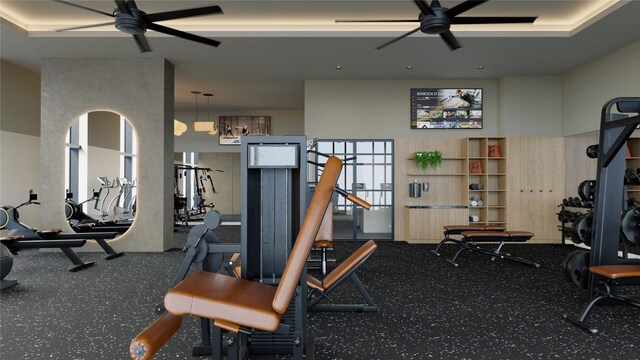 workout area with ceiling fan and a towering ceiling