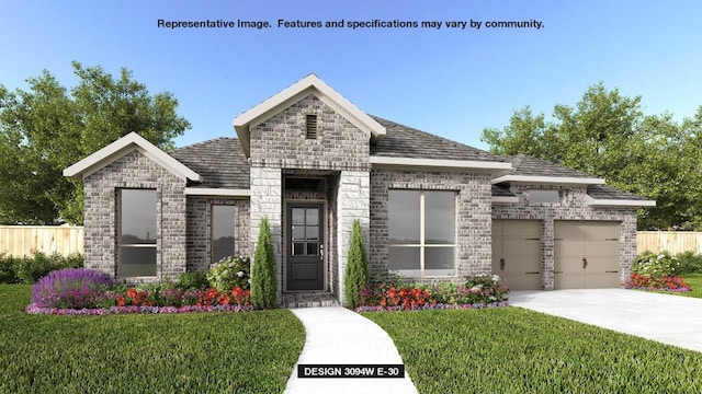 view of front of property featuring a garage and a front lawn