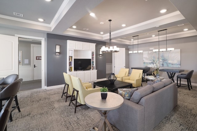 carpeted living room featuring a raised ceiling and ornamental molding