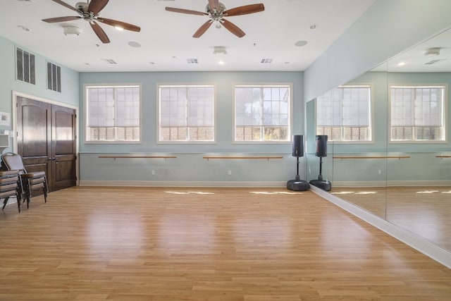 104 Bella Toscana Ave Unit 2211, Lakeway, TX 78734 - exercise room with light wood finished floors and a ceiling fan