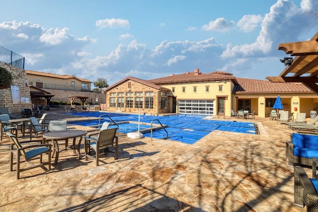 view of pool featuring a patio