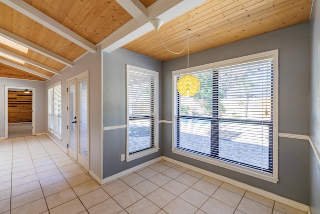 interior space featuring wooden ceiling, light tile patterned floors, baseboards, and vaulted ceiling with beams