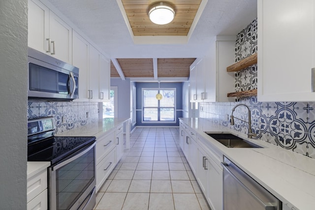 kitchen with a sink, wooden ceiling, appliances with stainless steel finishes, light tile patterned flooring, and open shelves