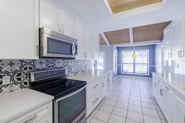 kitchen with wood ceiling, light tile patterned floors, backsplash, and stainless steel appliances