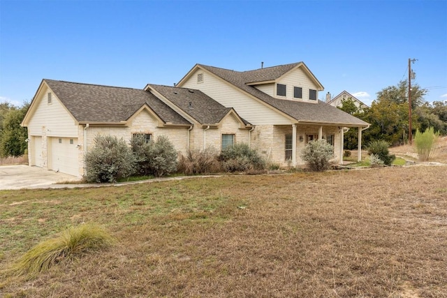 view of front of property with a garage and a front yard