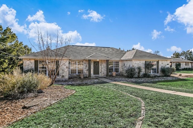 ranch-style home featuring a front yard