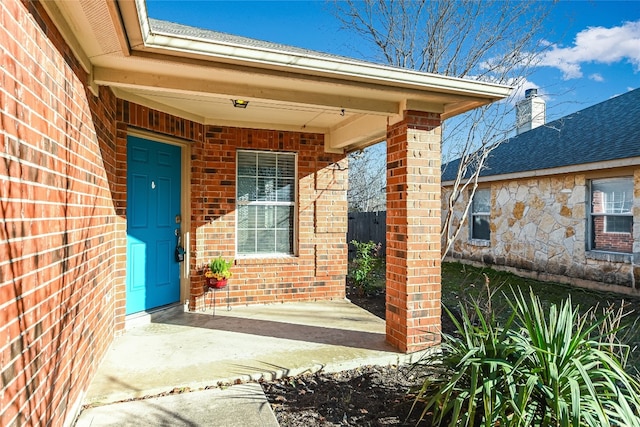 entrance to property with a patio area