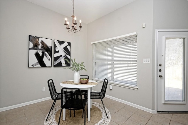 tiled dining space with plenty of natural light and a chandelier