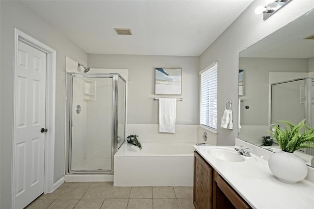 bathroom featuring tile patterned floors, independent shower and bath, and vanity