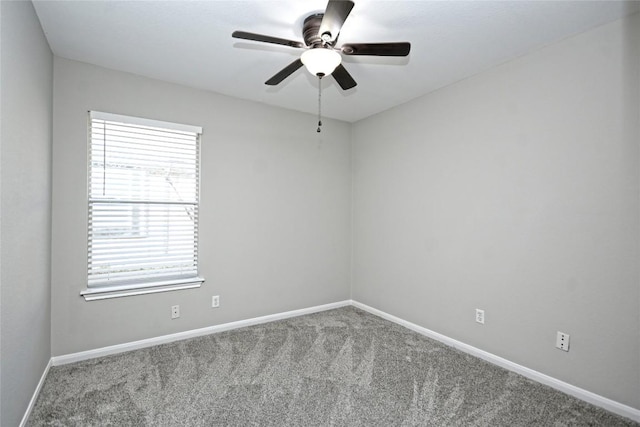 carpeted empty room with ceiling fan