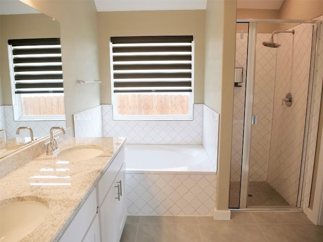 bathroom featuring vanity, tile patterned floors, and shower with separate bathtub