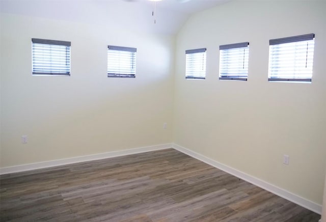 unfurnished room with lofted ceiling, dark hardwood / wood-style floors, and ceiling fan