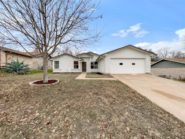 ranch-style home with a garage and a front yard