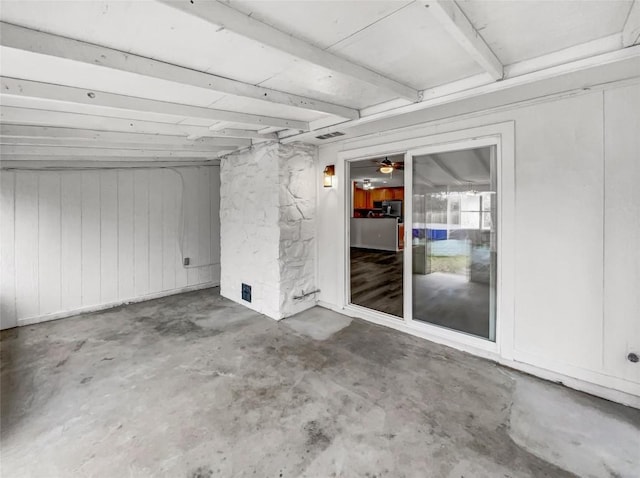 spare room with concrete flooring and ceiling fan