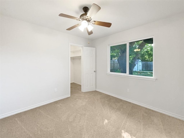 8222 Kearsarge Dr, Austin, TX 78745 - unfurnished bedroom featuring carpet, baseboards, a spacious closet, ceiling fan, and a closet