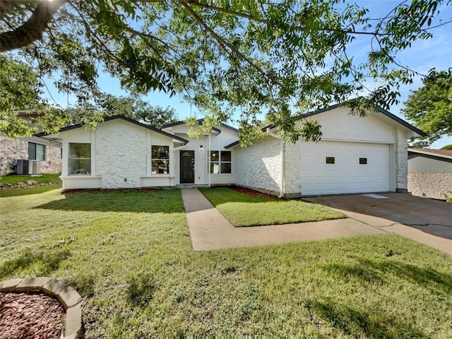 view of front of property with stone siding, a garage, concrete driveway, cooling unit, and a front lawn