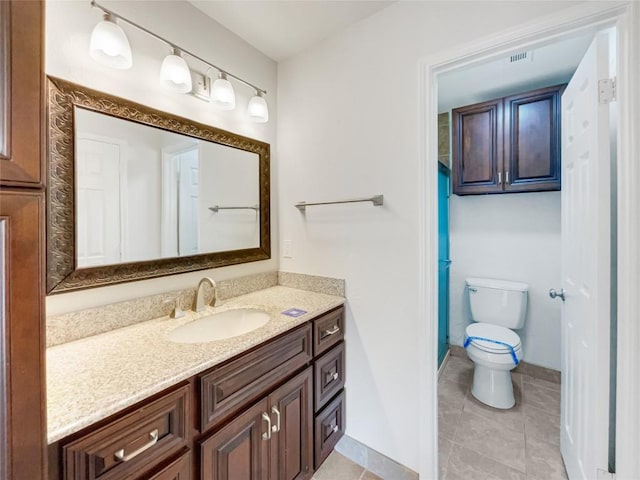 8222 Kearsarge Dr, Austin, TX 78745 - bathroom featuring vanity, toilet, tile patterned flooring, and baseboards