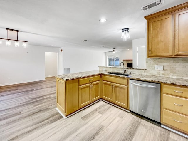 8222 Kearsarge Dr, Austin, TX 78745 - kitchen with dishwasher, light wood-style floors, backsplash, a peninsula, and a ceiling fan