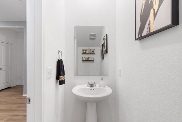 bathroom featuring wood-type flooring