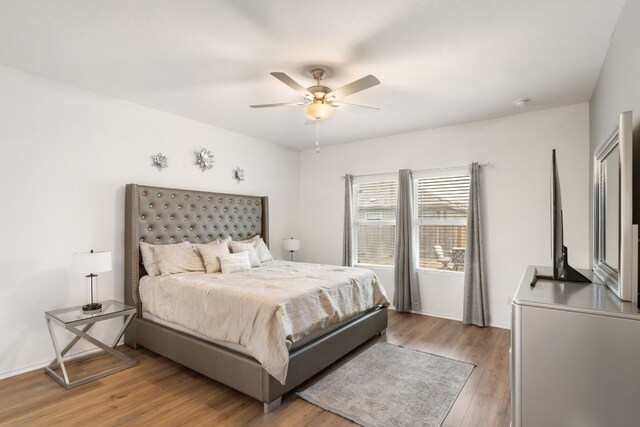 bedroom featuring hardwood / wood-style flooring and ceiling fan