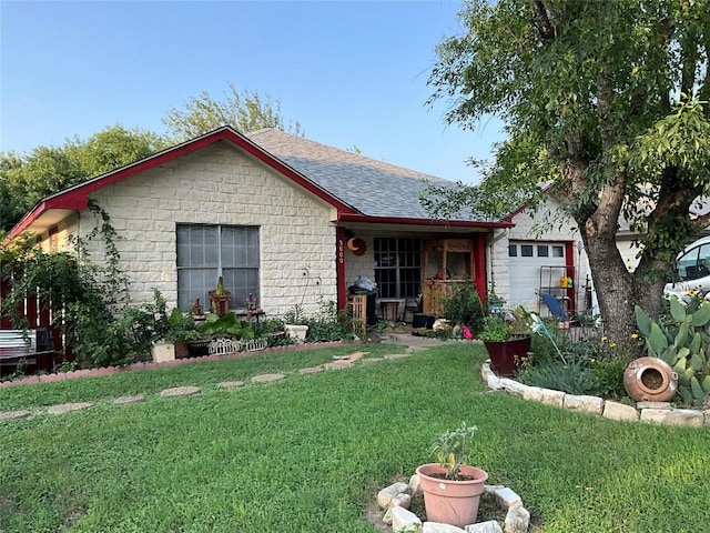 view of front of home featuring a garage and a front lawn