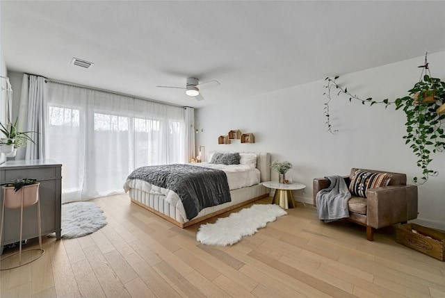 bedroom featuring light hardwood / wood-style floors and ceiling fan