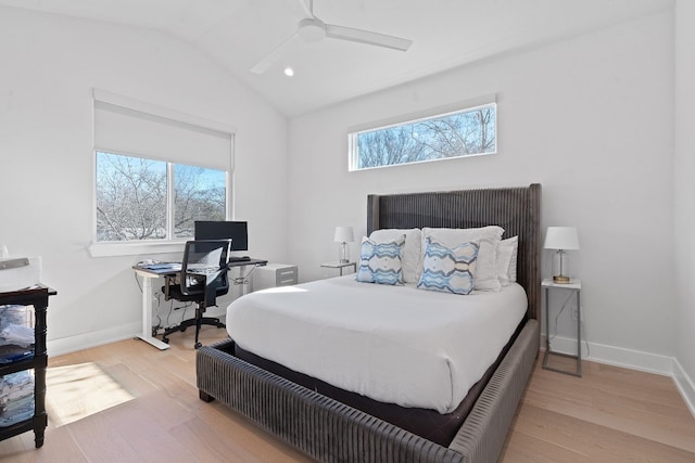 bedroom with ceiling fan, lofted ceiling, multiple windows, and light wood-type flooring