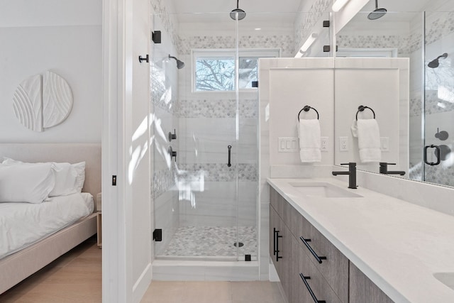 bathroom featuring crown molding, vanity, and a shower with shower door