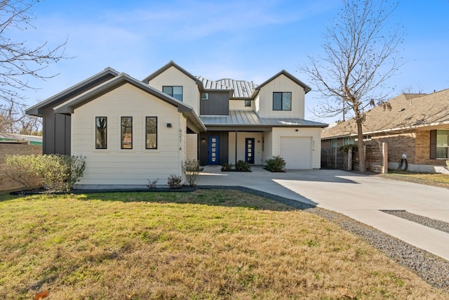 view of front facade with a garage and a front yard