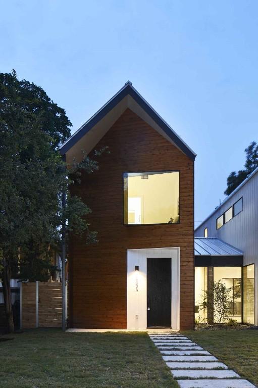 rear view of house with a lawn